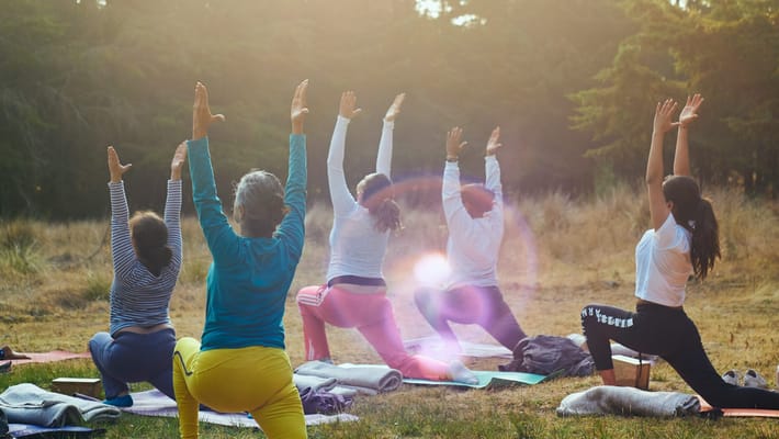 Group yoga session in an outdoor setting