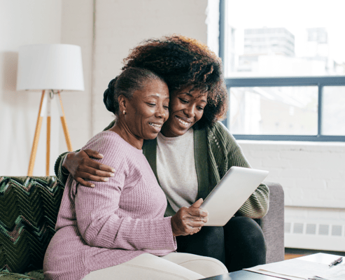 Two women enjoying time together in a cozy interior