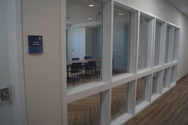 Meeting room with glass walls and table chairs