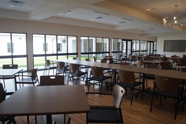 Spacious dining room with tables and chairs