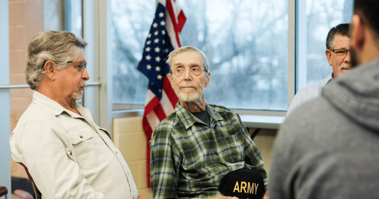 Residents engaged in conversation in a common area