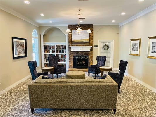 Cozy common area with seating and a fireplace