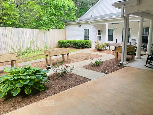 Outdoor garden area with benches and plants