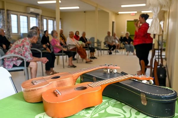 Residents attending a music activity in a common area