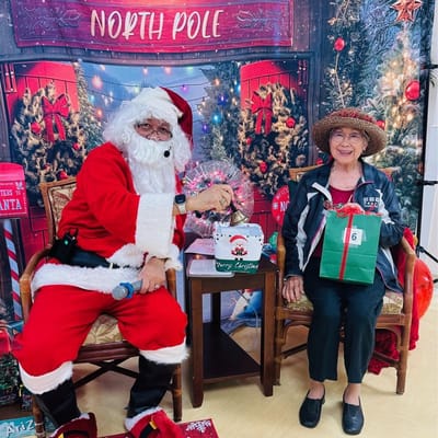 Resident interacting with Santa during Christmas event