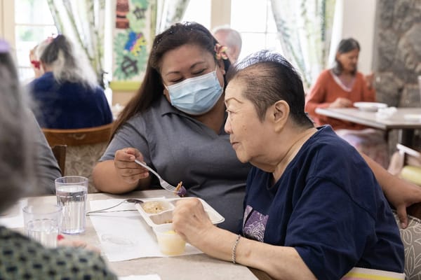 Residents enjoying a meal in the dining area
