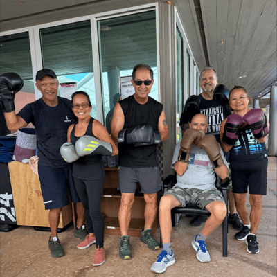 Residents participating in an outdoor boxing class