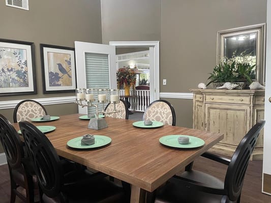 Dining area with a wooden table and decorative plates