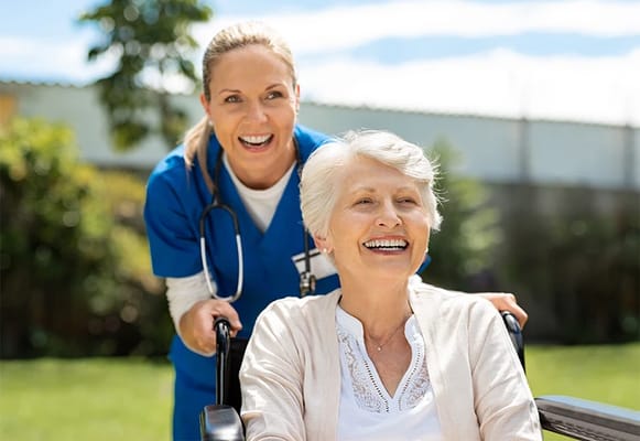 A caregiver and resident enjoying time outdoors