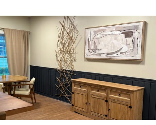 Bright interior area with seating and decorative art