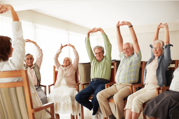 Residents participating in a seated exercise activity