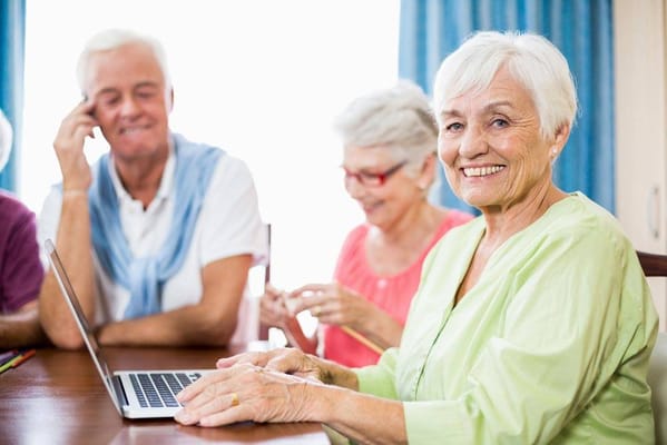 Residents engaging in a group activity at a table