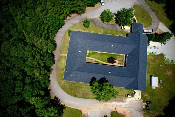 Aerial view of a nursing home surrounded by greenery