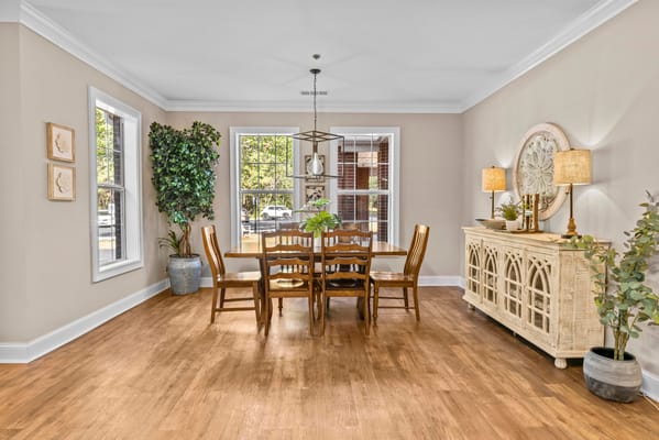 Bright and welcoming common area with dining table