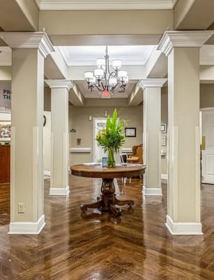 Interior entrance with a decorative table and chandelier