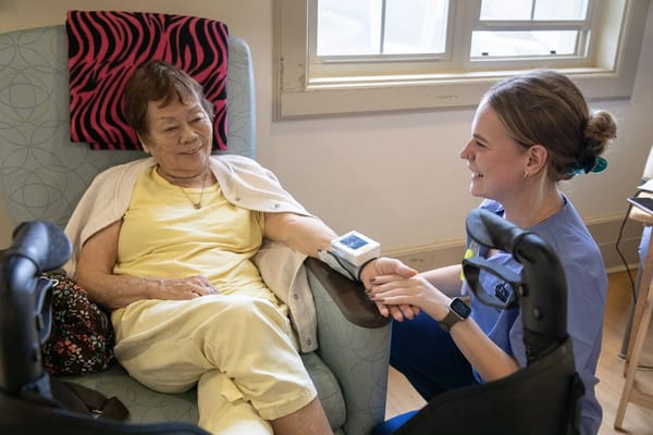 Healthcare professional attending to a resident