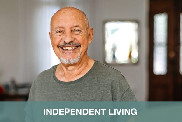 Senior man smiling in a cozy living space