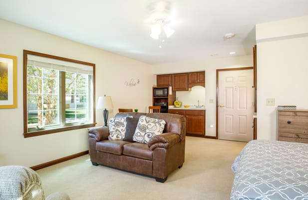 Cozy private resident room with living area and kitchenette