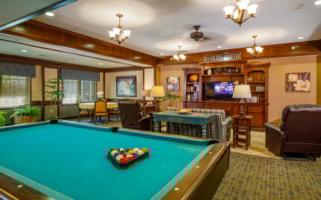 Common area with a pool table and seating
