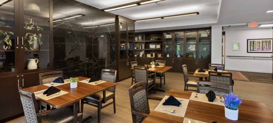 Dining room with wooden tables and plants