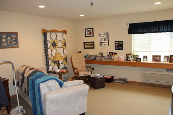 Cozy interior common area with seating and photos