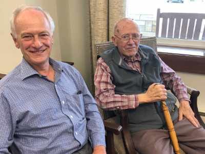 Two residents enjoying time together indoors