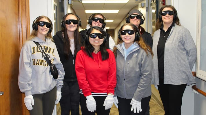 Staff and residents participating in a sensory activity