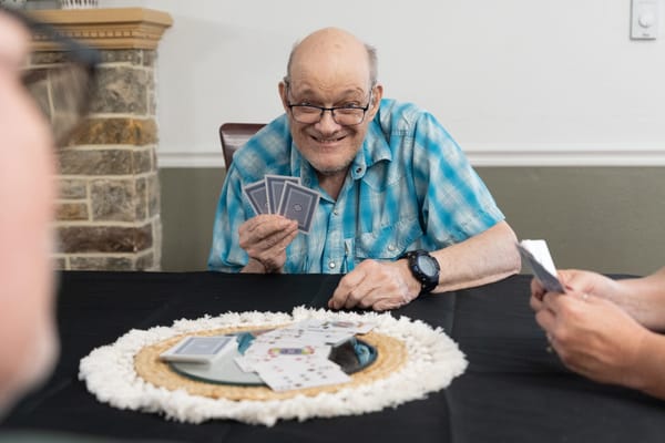 Resident enjoying a card game with friends