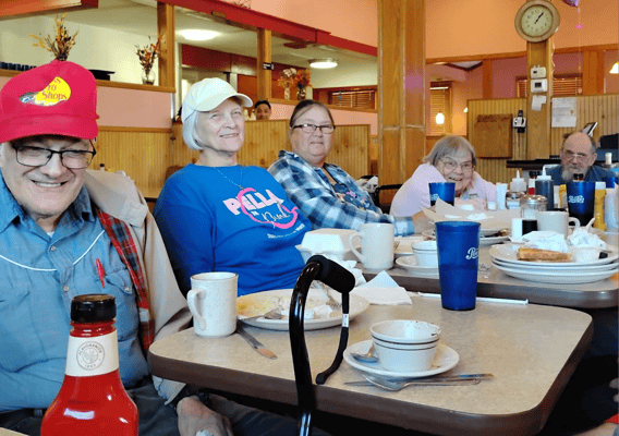 Residents enjoying a meal in the dining area