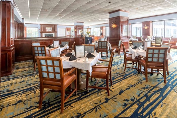 Dining room arrangement with tables and chairs