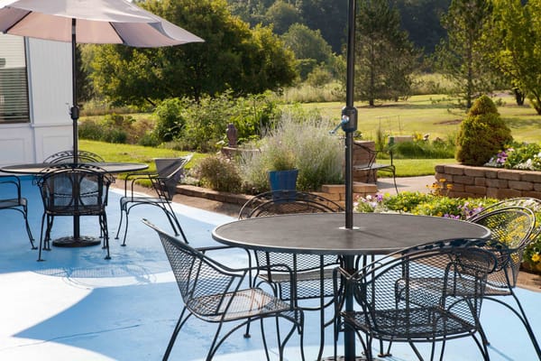 Outdoor seating area with tables and chairs