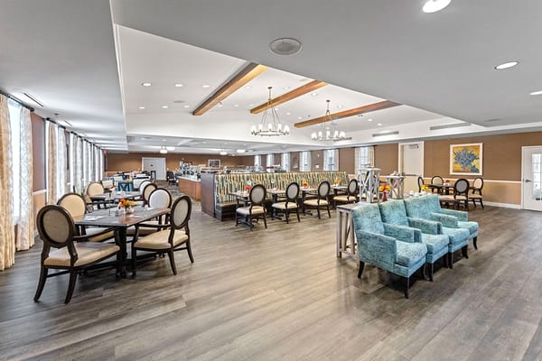 Bright dining area with tables and chairs
