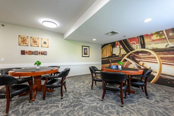 Common area with seating and decorative wall