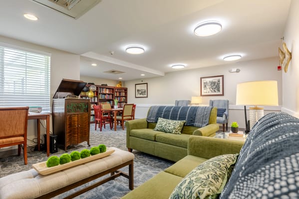 Cozy sitting area in a common room with bookshelves