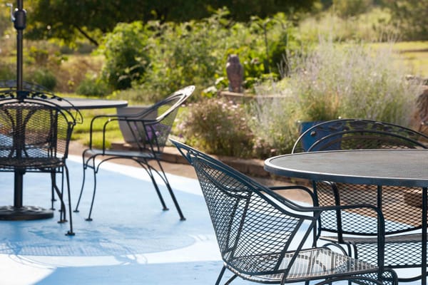 Outdoor seating area with tables and chairs