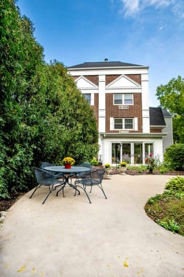 Outdoor seating area with view of the facility building