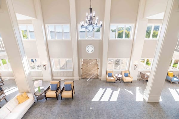 Bright, spacious common area with high ceilings and natural light