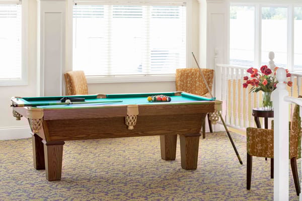 Interior shot of a billiard table in a common area