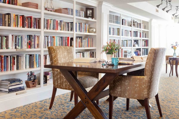 Bright common area with bookshelves and seating