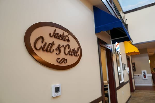 Interior sign for a hair salon within the facility