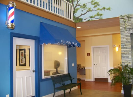 Interior view of a salon area with a blue canopy