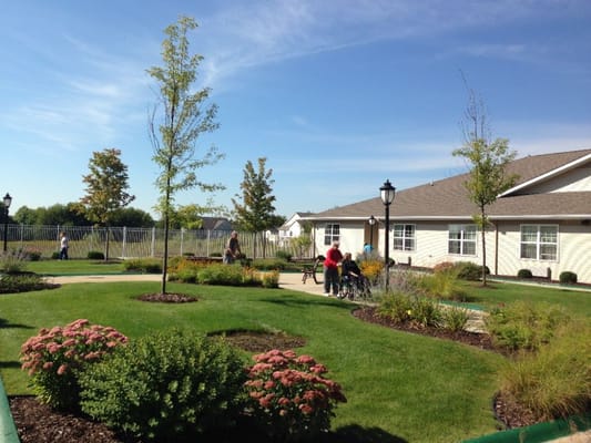 Residents enjoying a garden space with pathways