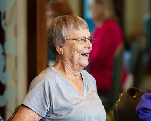 Resident smiling in a common area