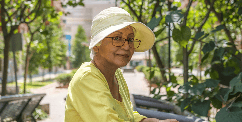 A senior woman enjoying a sunny day in the garden