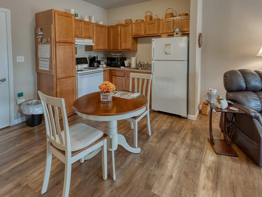Cozy kitchen area with dining table and chairs
