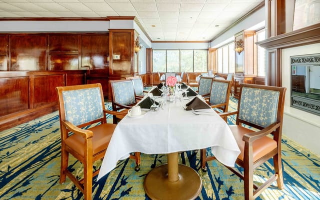 Elegant dining room setup with tables and chairs