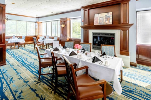 Elegant dining room setting with tables and flowers