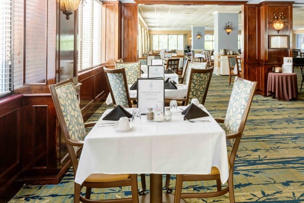 Elegant dining room setup with tables and chairs