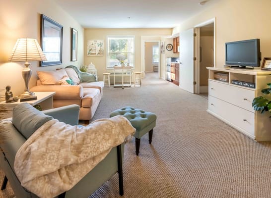 Cozy sitting area in a resident's room with soft lighting