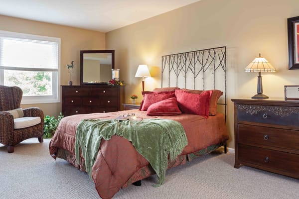 Cozy bedroom in a senior living facility with warm decor